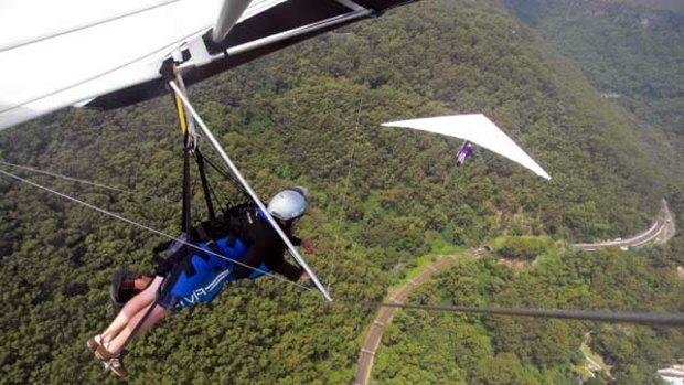 Fly by wire ... Curt Warren and Ben Stubbs glide over Stanwell Tops.