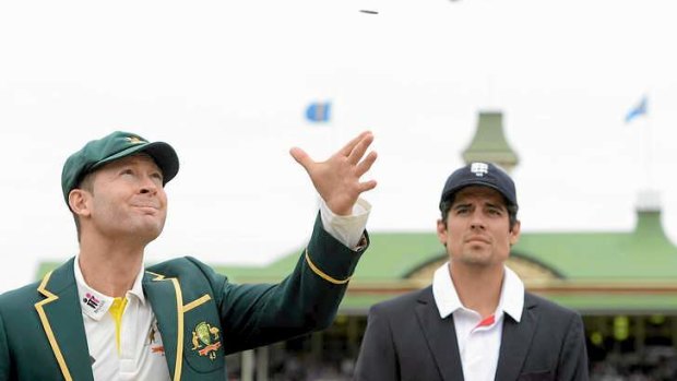 A win for England: Australia captain Michael Clarke tosses the coin alongside England captain Alastair Cook. Cook won the toss and sent Australia in on an SCG greentop.