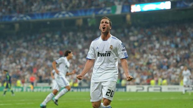 Gonzalo Higuain of Real Madrid celebrates scoring his side's second goal.