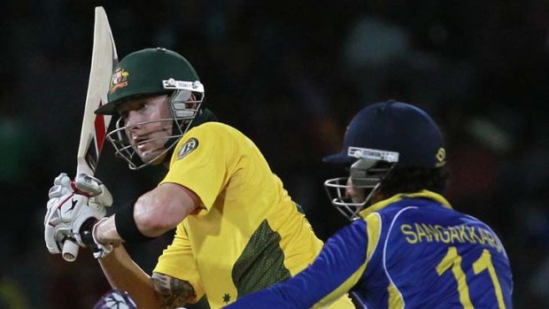 Series wrapped up ... Australia's captain Michael Clarke watches his shot next to Sri Lanka's Kumar Sangakkara.