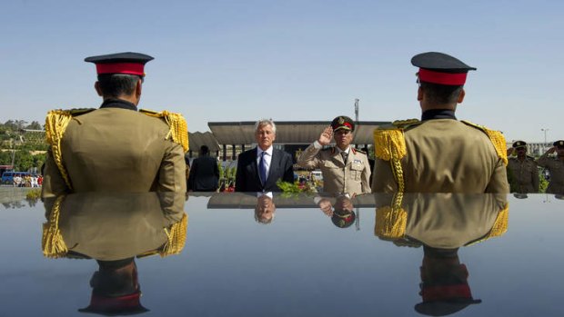 US Secretary of Defence Chuck Hagel, second left, stands with an Egyptian army official before laying a wreath at the tomb of late President Anwar al-Sadat in Cairo earlier this year.