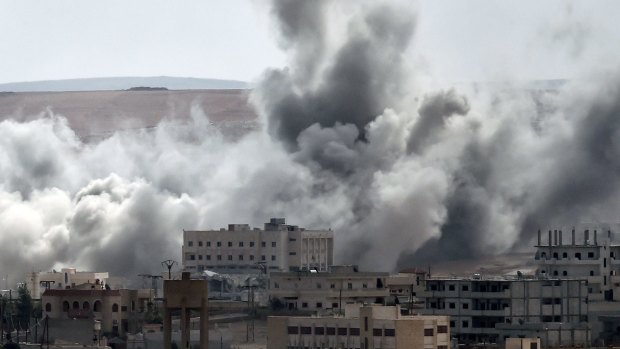 Smoke rises from an air strike on the southwestern part of the Syrian town of Kobane. The coalition continues air strikes on IS targets in Kobane.
