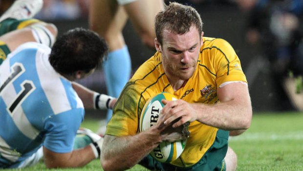 Comeback ... Pat McCabe scores the try that triggers the Wallabies' comeback against Argentina.