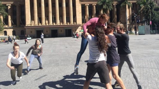Nine dancers are performing for nine hours in King George Square in "The Stance".