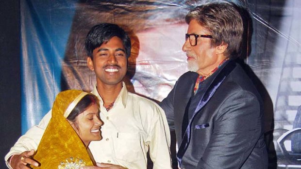 Buying a new house ... Sushil Kumar celebrates with his wife as he is congratulated by Bollywood movie legend  Amitabh Bachchan.