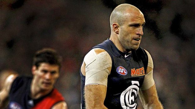 Chris Judd gets ready to kick during the round 18 game against Essendon.