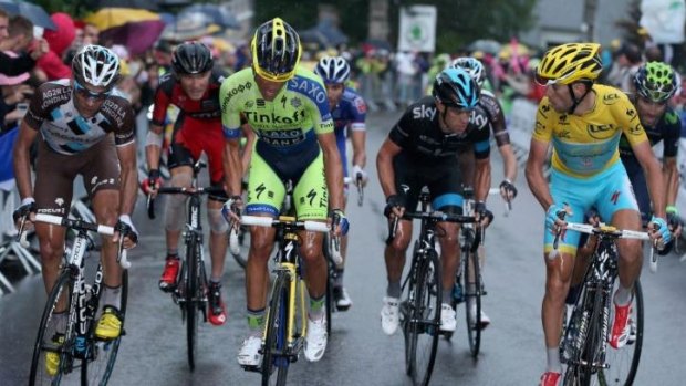 Alberto Contador (c) launches his attack with Vincenzo Nibali (R) and Richie Porte (2nd R) ready to respond.