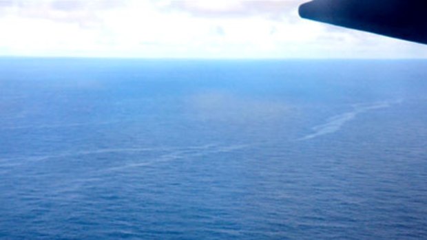 A slick that is believed to be from the fuel of Air France flight AF447 is seen from the window of a Brazilian Air Force plane.