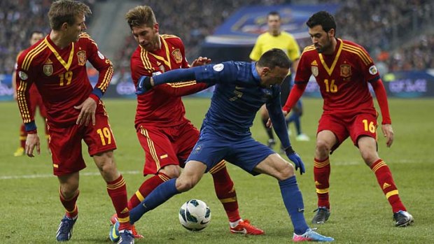 France's Franck Ribery (second right) is surrounded by Spain's Monreal Eraso (left), Sergio Ramos Garcia (second left) and Sergio Busquets Burgos during the World Cup qualifying match between the two countries.