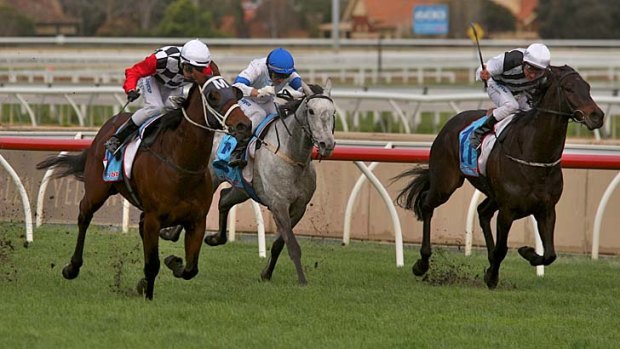 Effortless: Chris Symons punches out Second Effort (left) to win the Lawrence Stakes at Caulfield yesterday.