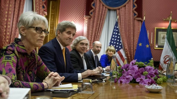Pushing on with negotiations despite  Republican backlash ...  US Secretary of State John Kerry, second from left, flanked by US and European delegates, meets Iranian officials in Lausanne.