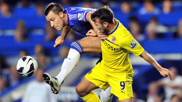 Reading striker Adam Le Fondre, right, tangles with Chelsea's John Terry.
