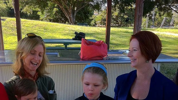 Jenny Johansen, with Sam and Helena, speak with Prime Minister Julia Gillard in Moorooka.