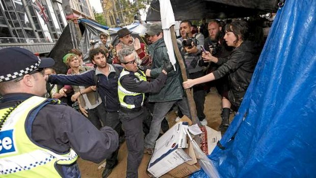Police attempt to end the Occupy Melbourne protest in the City Square in 2011.
