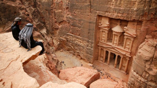 Sands of time … Petra's Al-Khazneh viewed from the surrounding high rock walls.