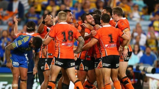 Jubilation: Wests Tigers celebrate their thrilling win over Parramatta at ANZ Stadium.