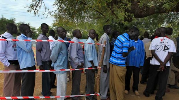 South Sudanese queue under a tree in the streets of Juba to register to vote in the upcoming referendum for independence.