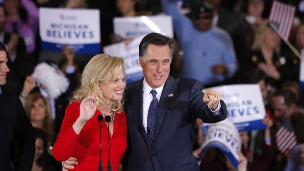 Mitt Romney and his wife Ann celebrate victory in Michigan.