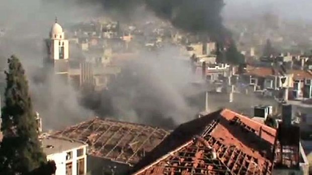 Civilians reported trapped... footage from Monday reportedly shows regime forces continuing to attack the Syrian city of Homs.