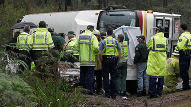 Rescue workers attend the scene of the tour bus crash near Manjimup.