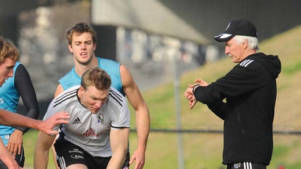 Timing: Magpies coach Mick Malthouse and coach-in-waiting Nathan Buckley at training yesterday.