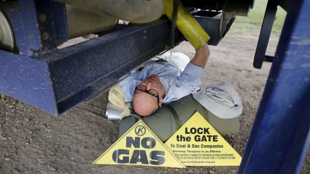 Simon Pockley, 64, locked under a Santos CSG rig truck headed towards the Pilliga forest. He's in Bellata. Photo: Supplied.