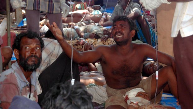 Injured civilians are seen in a make-shift hospital in this photograph released by the pro-Liberation Tigers of Tamil Eelam group.