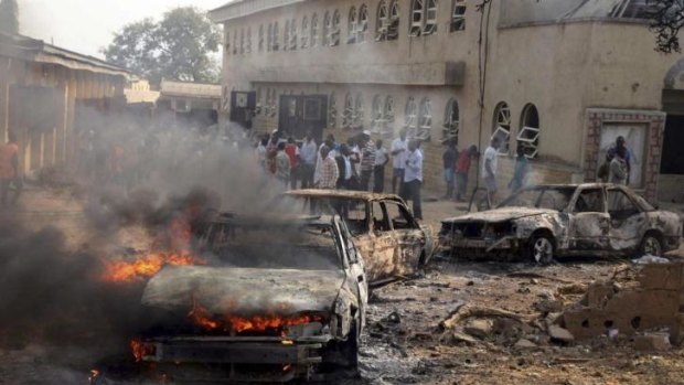 A car burns at the scene of a Christmas Day-bomb explosion that the Islamist militant group Boko Haram claimed responsibility for at St Theresa Catholic Church at Madalla just outside Nigeria's capital Abuja. The Islamist group have killed 1800 Nigerians this year alone.