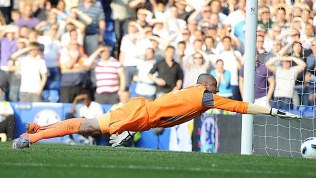 Contentious ... Tottenham's Heurelho Gomes tries to stop Frank Lampard's shot from crossing the line. The goal was awarded.
