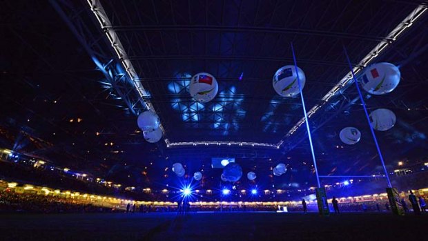 Air balls: Inflatables display the 14 competing nations at the opening ceremony in Cardiff.
