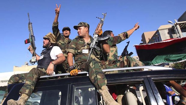On edge &#8230; revolutionary fighters prepare to confront Gaddafi loyalists in Tripoli.