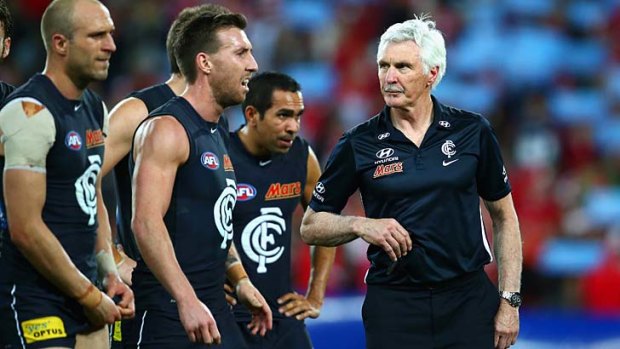 Mick Malthouse with his players after the game.
