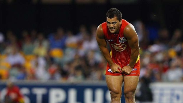 Tough night at the office: Karmichael Hunt feels the strain in round two.