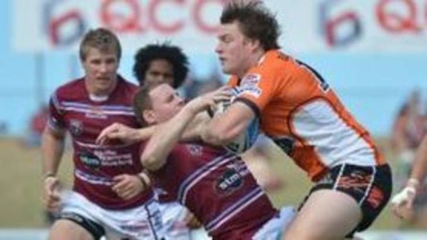 Mackay Cutters Matt Minto can't stop East Tigers' Tim Glasby during the opening week of the Intrust Super Cup finals.