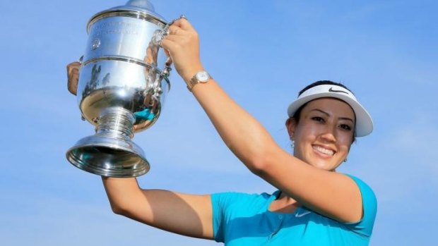 Michelle Wie holds the trophy after her victory at US Women's Open.
