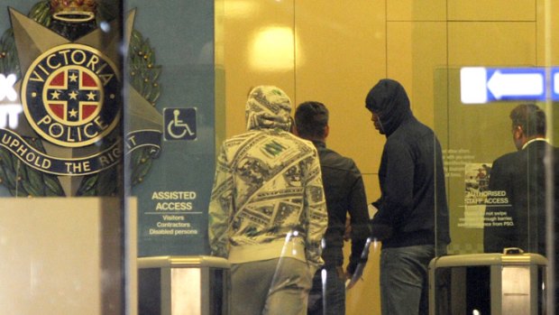 Members of Southern Stars leave a Melbourne police station early Monday morning.