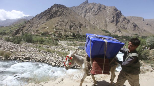 An boy and his donkey carry a ballot box to a remote area of Panjshir province, north of Kabul.