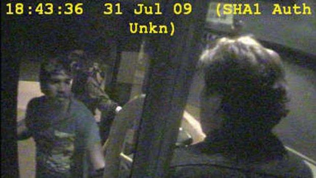 A CCTV image shows the bus driver being confronted by a group of youths in Armadale last night.