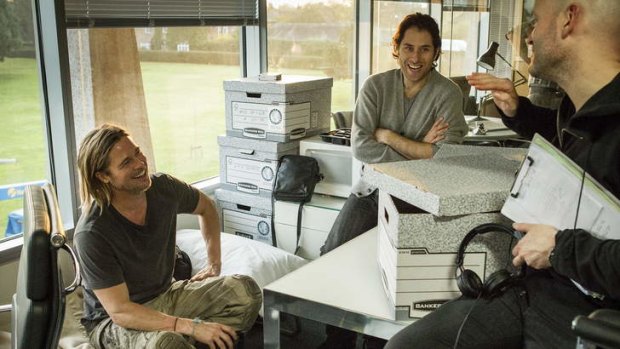 Happy together: Brad Pitt, producer Jeremy Kleiner and director Marc Forster on the set of <i>World War Z</i>.