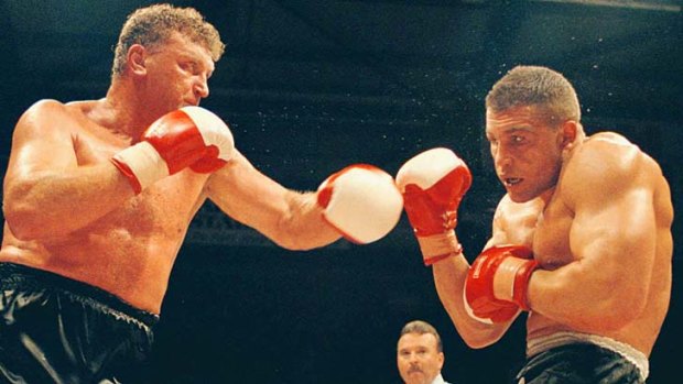 Joe Bugner (left) and Vince Cervi fight for the title in 1995.