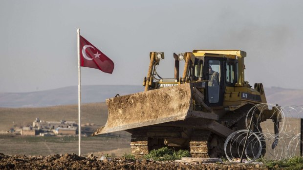A bulldozer belonging to the Turkish army at the site 200 metres from the Turkish-Syrian border to which Suleyman Shah's remains were relocated.