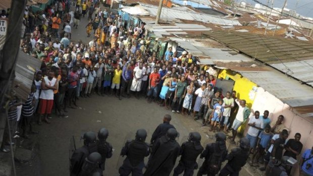 Meanwhile, in Liberia, protesters and security forces face off.
