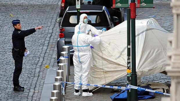 Police  at the site of a shooting at the Jewish Museum in   Brussels in which four people were killed.