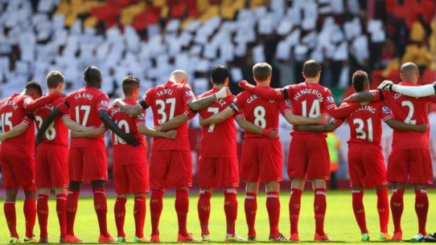 Brothers in arms: Liverpool players acknowledge a minute's silence for the Hillsborough victims on the 25th anniversary of the tragedy before the match.