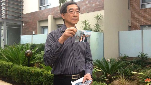 Grief-striken: The father of Henry Kwan, Stephen, explains what happened in the apartment.