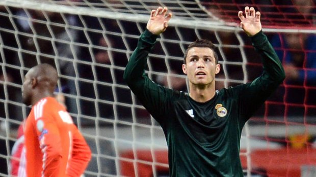 Real Madrid forward Cristiano Ronaldo reacts after scoring a goal against Ajax.