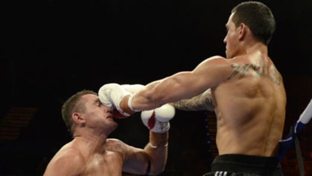 Impressive ... Sonny Bill Williams dominates Scott Lewis in their six-round contest on the Gold Coast on Saturday.
