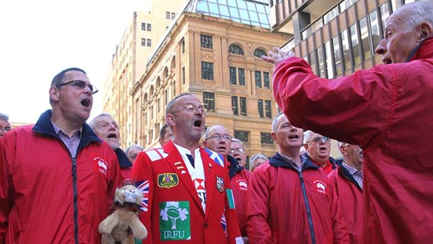 The Lions choir performs in Martin Place on Wednesday prior to the Lions final decider game on Saturday.