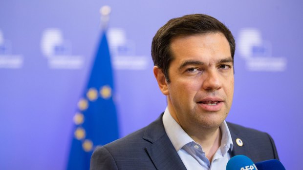 'We fought hard abroad, we must now fight at home against vested interests' ... Greek Prime Minister Alexis Tsipras speaks to journalists following bailout talks in Brussels, Belgium.