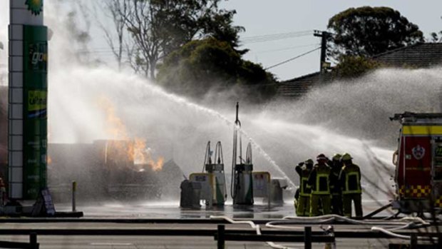 Firefighters tackle the blaze at the service station in Liverpool.